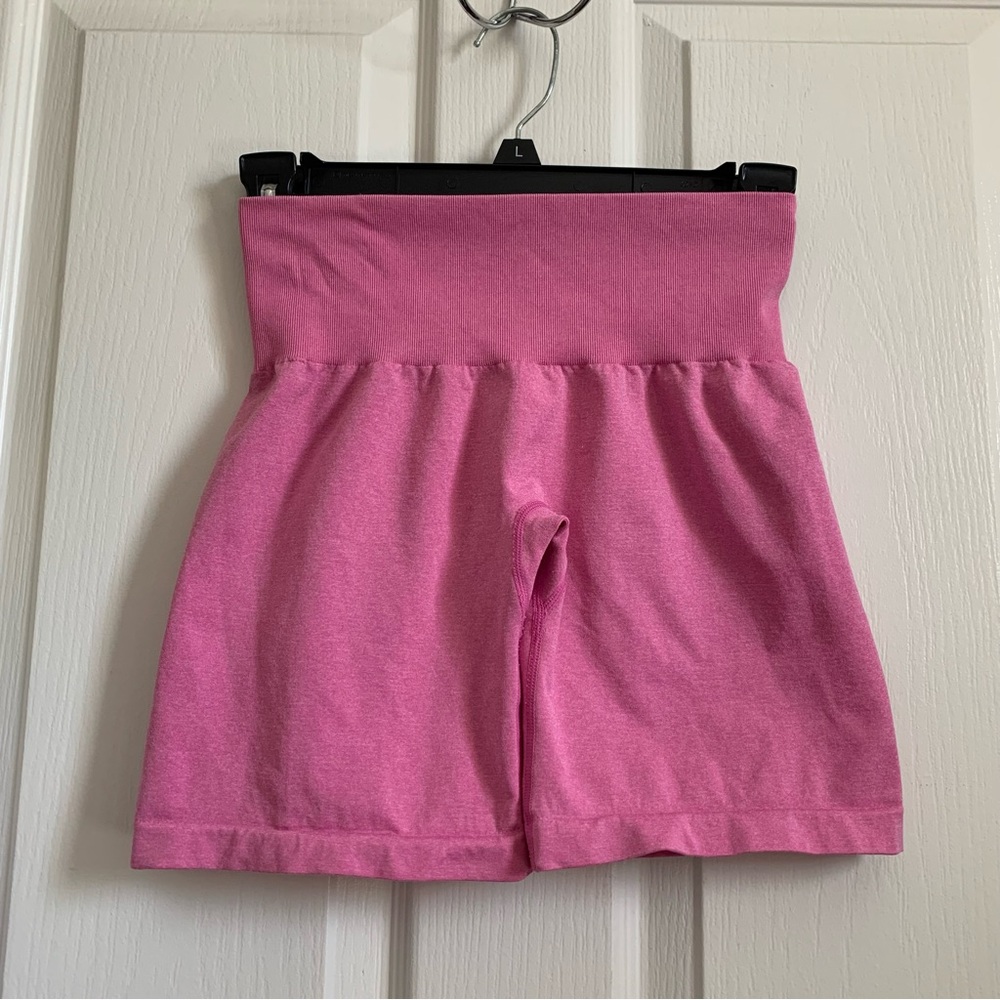 Bubble gum pink NVGTN shorts.